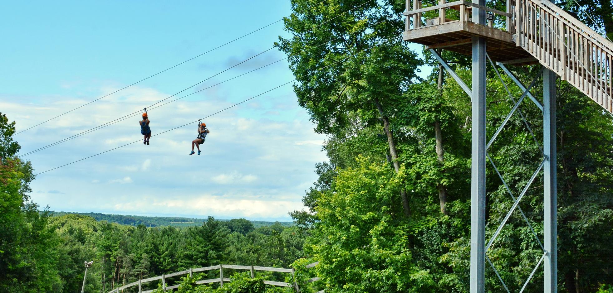 e sliding down a zip line at Boler Mountain's Treetop Adventure Park