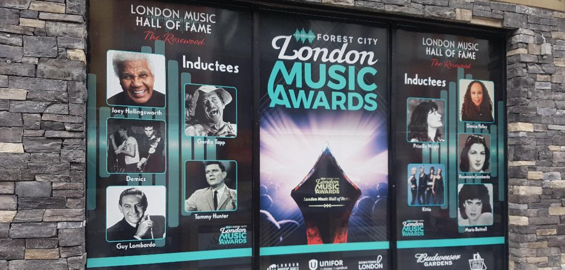 london music awards poster displayed against a brick wall