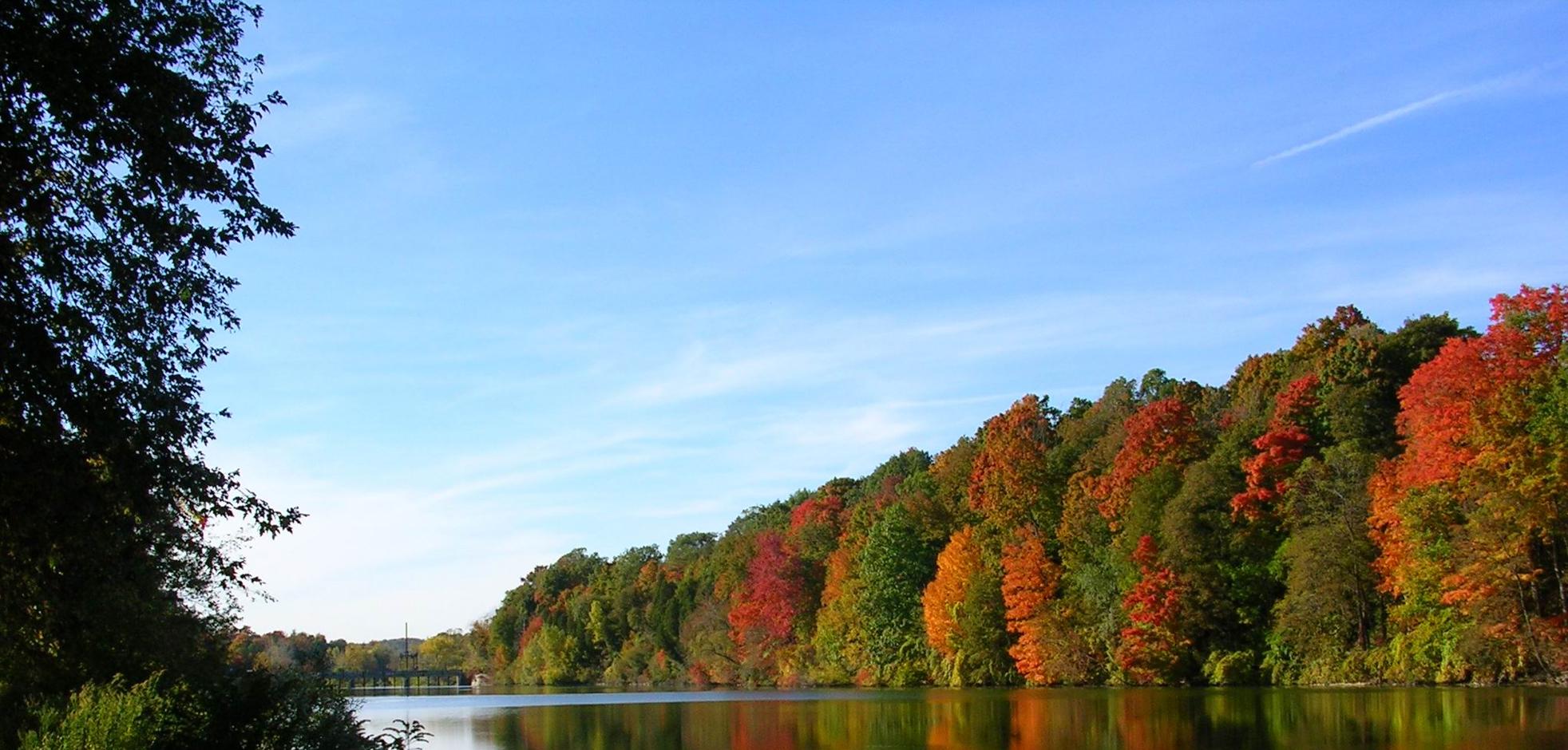Springbank Park view of the Thames River with Fall colours in London, Ontario, Canada.