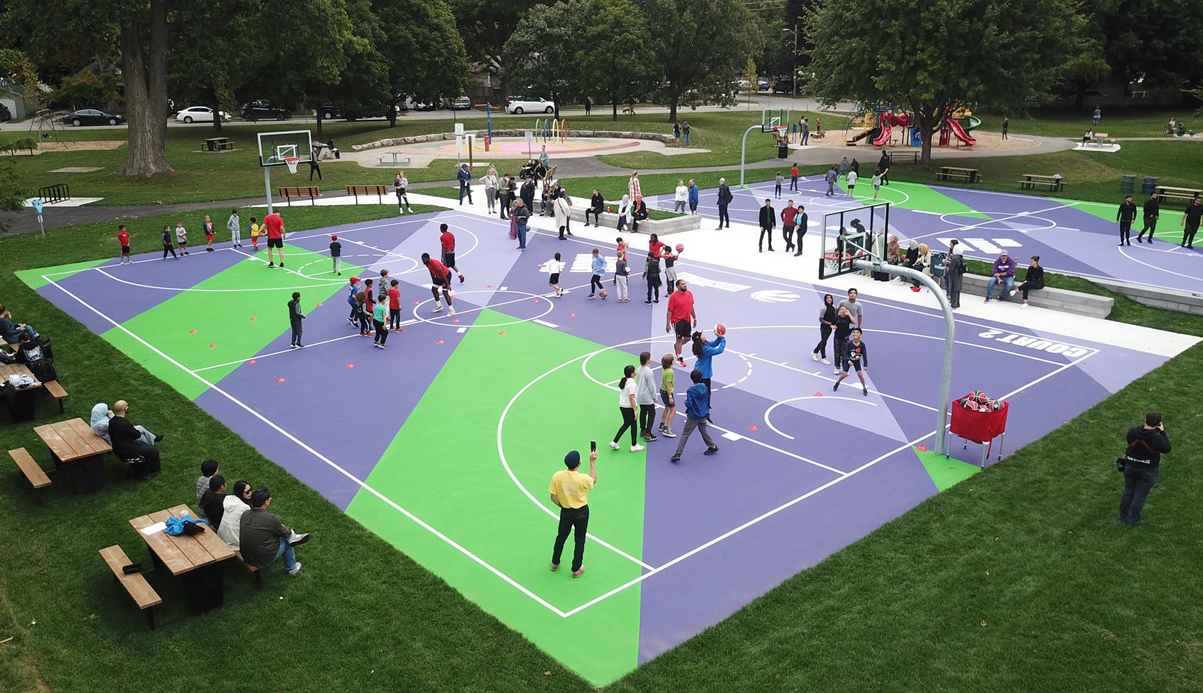 people playing basketball on a court