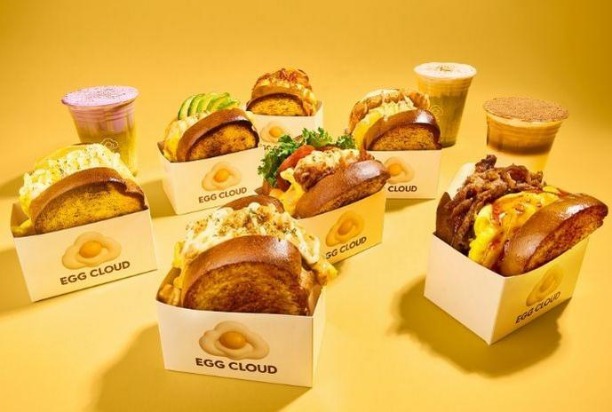 Lineup of Egg Cloud sandwiches and drinks displayed together.