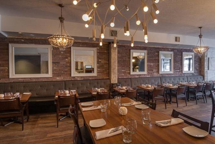 room with dining tables in Abruzzi Ristorante