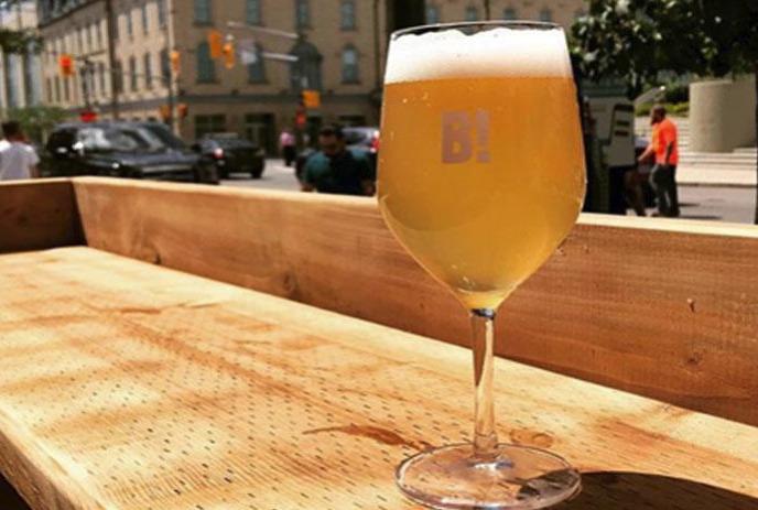 glass full of a beverage on a table