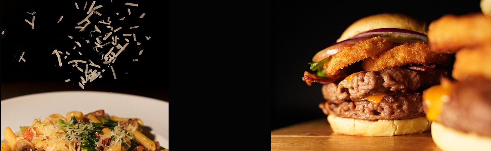 Plate of pasta and a plate of loaded burger