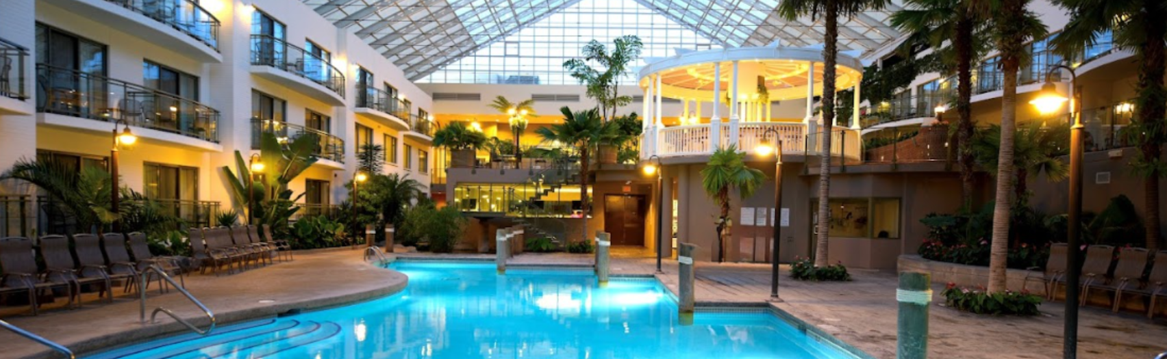 Indoor atrium with pool and waterslide.