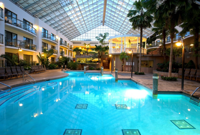 indoor pool and atrium at the best western plus lamplighter inn and conference centre
