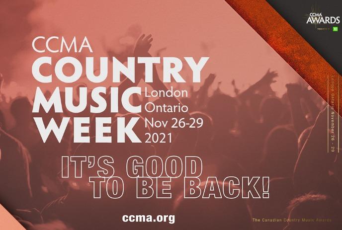 hands waiving in the air at a concert with the 2021 ccma country music week logo