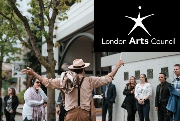 London Arts Council logo and crowd standing outdoors listening to a speaker