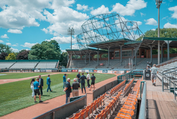 People walking across the field at Labatt Memorial Park as part of a guided walking tour