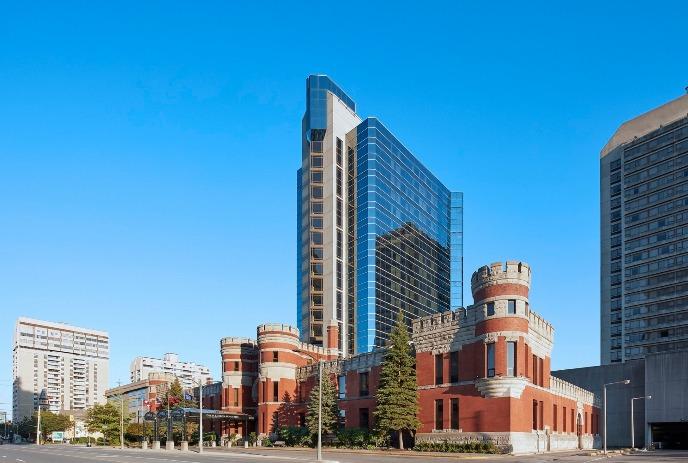 The Delta Hotel by Marriott London Armouries from the outside on a sunny day.