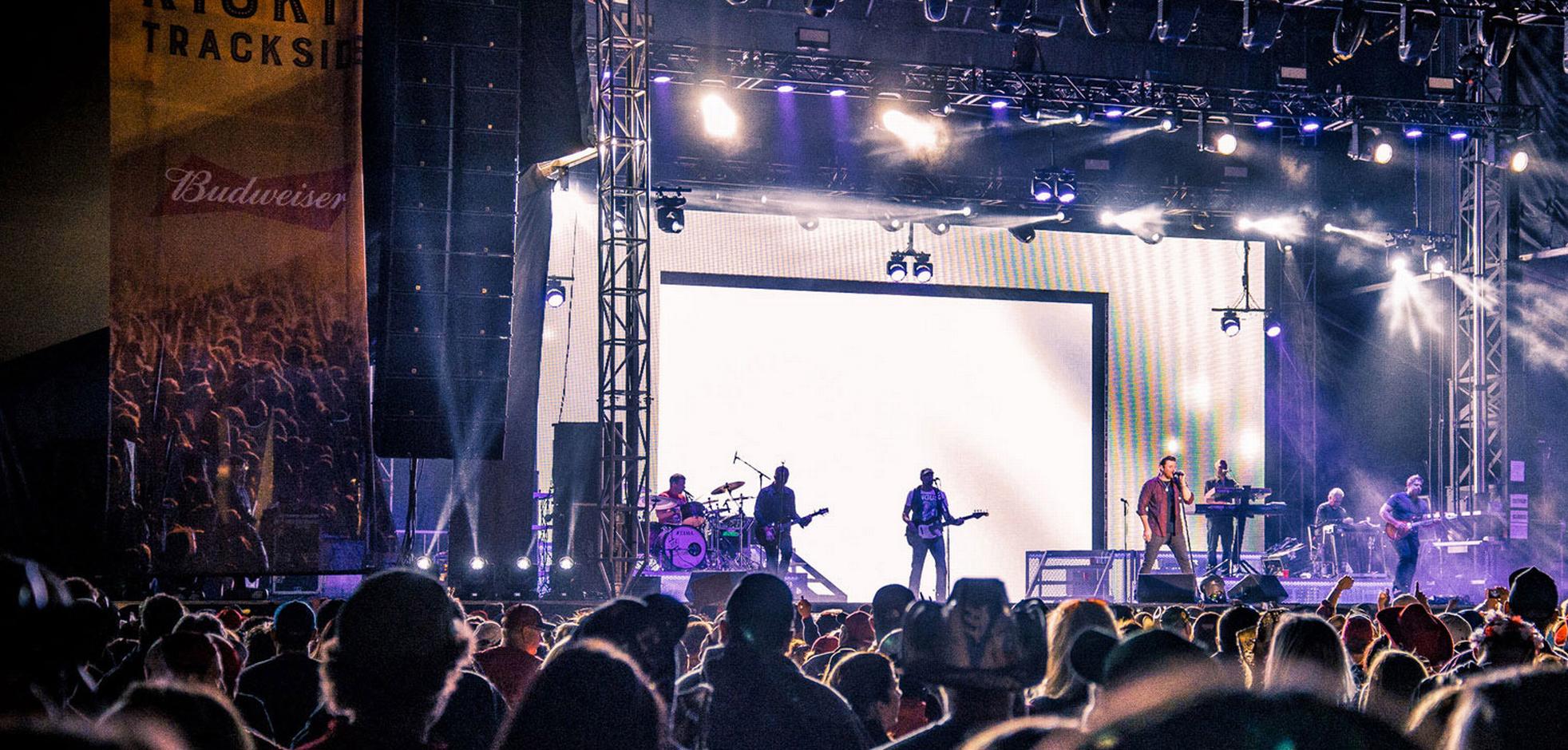 audience viewing band playing on stage