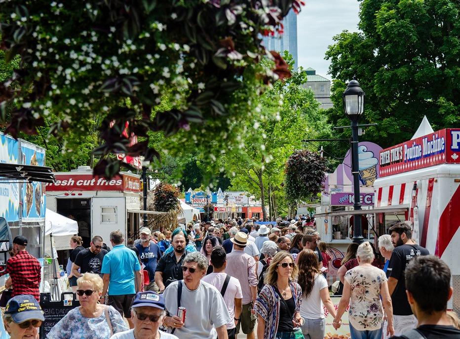 A large group of people gathered in Victoria Park for the London International Food & Drink Festival located in London, ON