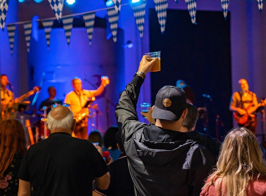 A crowd gatered watching a band play on stage at the Oktober Fall Fest held at 100 Kellogg Lane  in London, Ontario