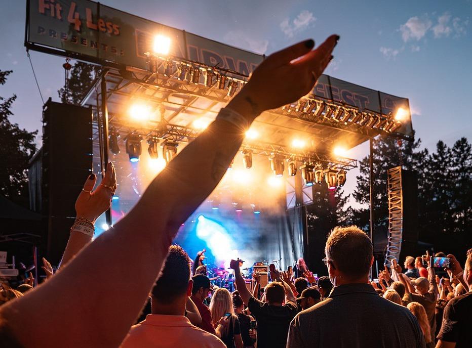 People attending a live outdoor concert at Fit4Less Fairway Fest located at East Park in London, Ontario
