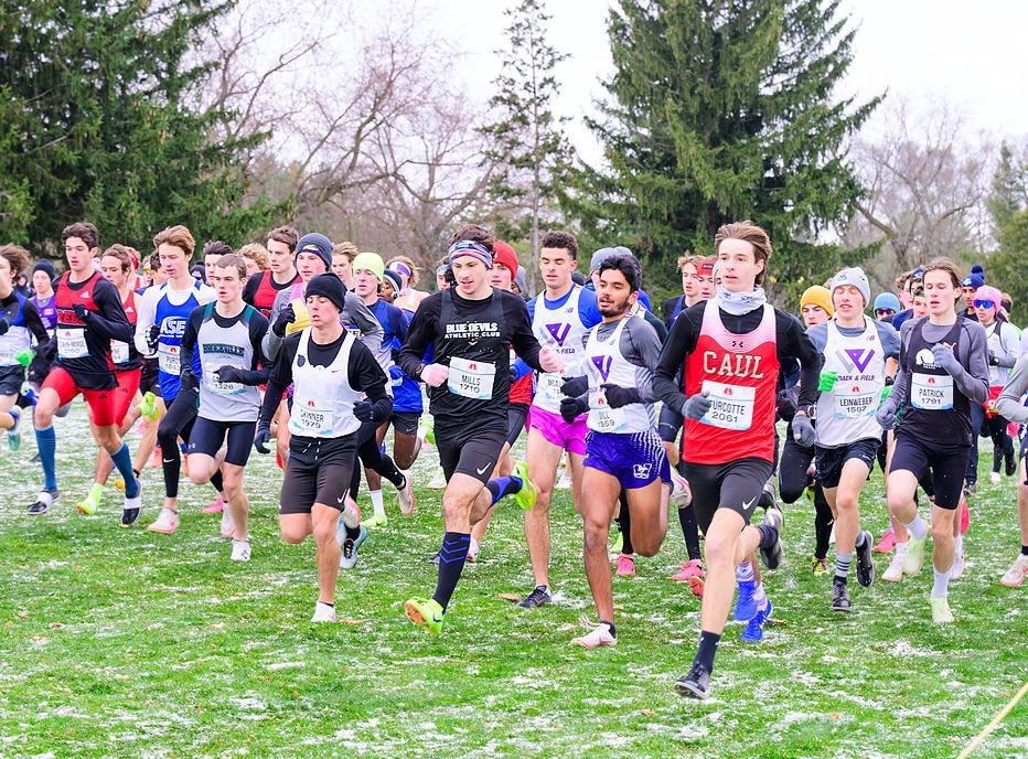 A large group of people running outdoors in The Canadian Cross Country Championships held in London, Ontario