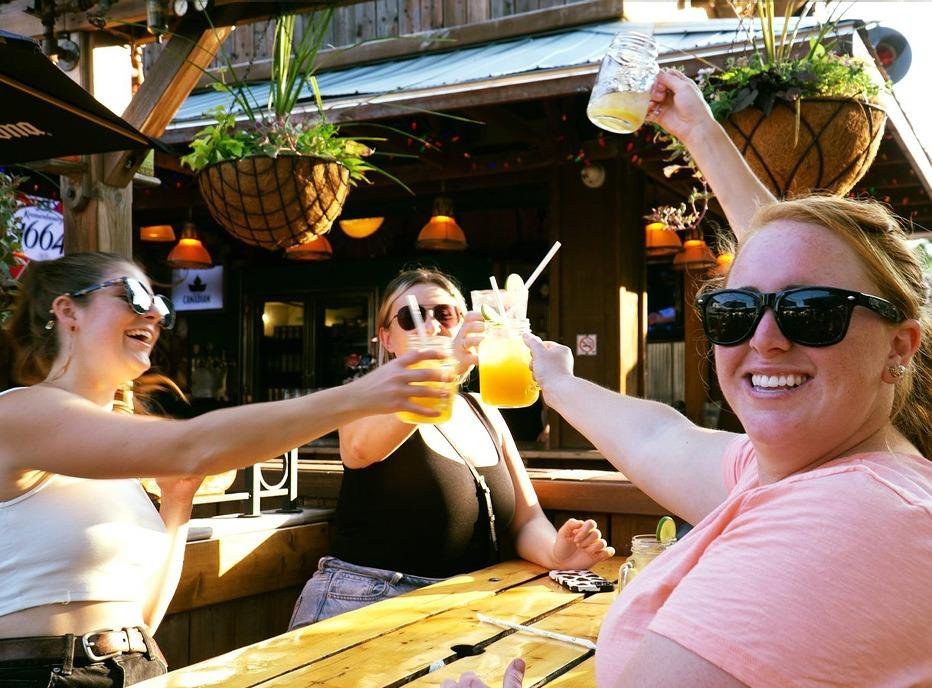A group of females sitting on a patio with drinks at Barney's in London, Ontario