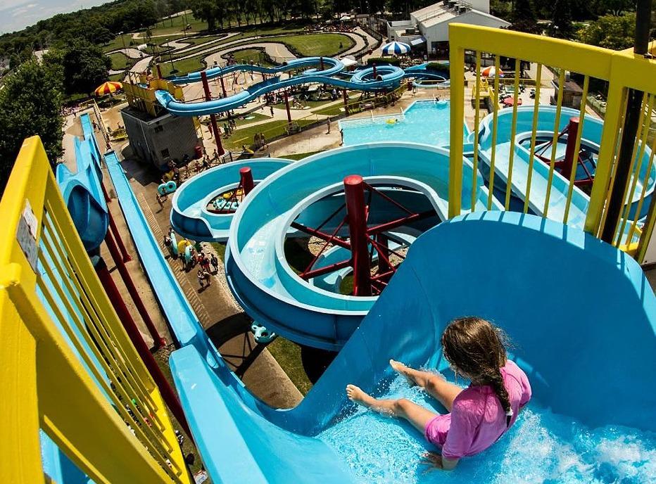 A young girl going down a water slide at East Park located in London, Ontario