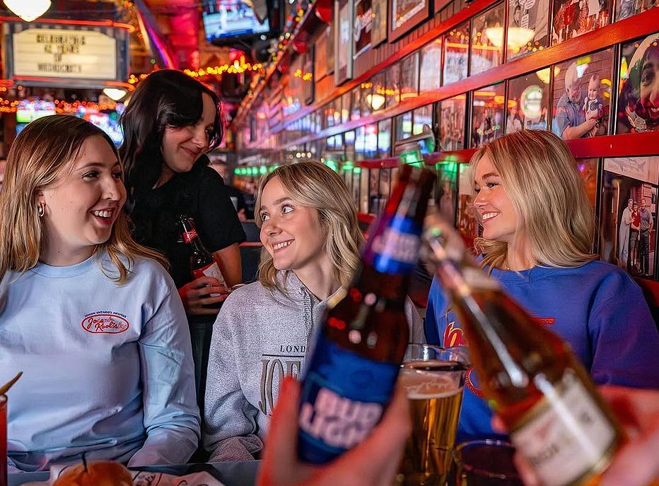 A group of friends gathered at Joe Kool's bar located in London, Ontario