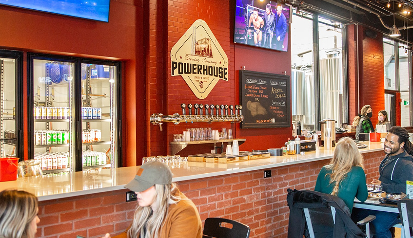 People sitting by the bar at Powerhouse Brewing Co. at 100 Kellogg Lane.