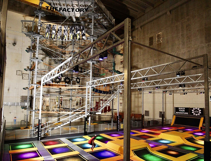 A child jumping on the trampolines at The Factory indoor adventure park at 100 Kellogg Lane