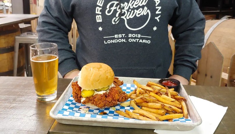 Spread of Fried chicken, fries and a cold beer from Kyle’s Fried Chicken in London, Ontario