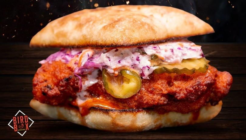 Fried Chicken sandwich with red onions and cheese from Bird Box located in London, Ontario