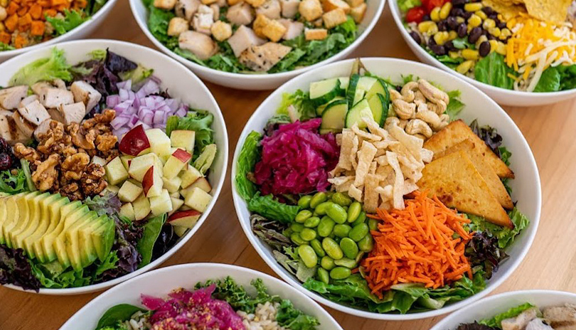 Various healthy vegetable based dishes from Green Window displayed on a table