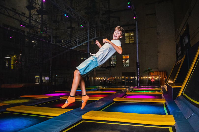 A young boy bouncing at the trampoline park at The Factory located in London, Ontario