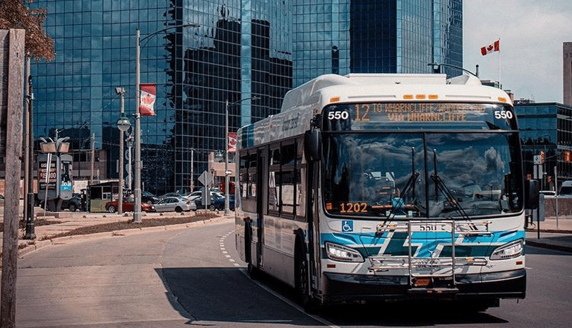 LTC Bus driving on a London Ontario road.