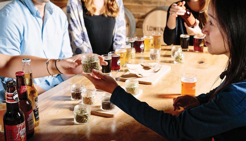 A small group of people sampling various beers from the Labatt Brewery Tour in London, Ontario