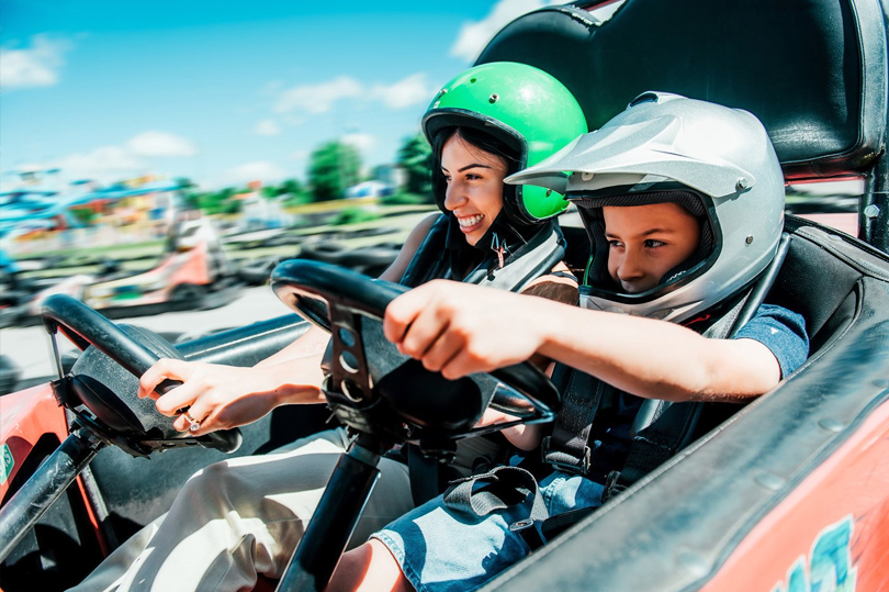 A mother and her son racing on a gocart at East Park located in London, Ontario