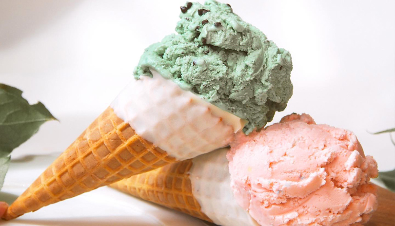 Two ice cream cones resting on a table from The Ice Cream Bowl located in London, Ontario