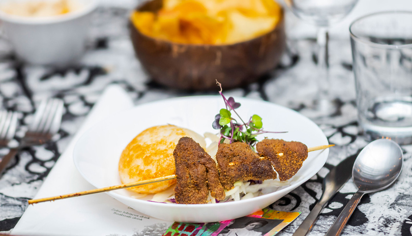 A plate displayed on a table with African cuisine from YaYa's Kitchen located in London, Ontario