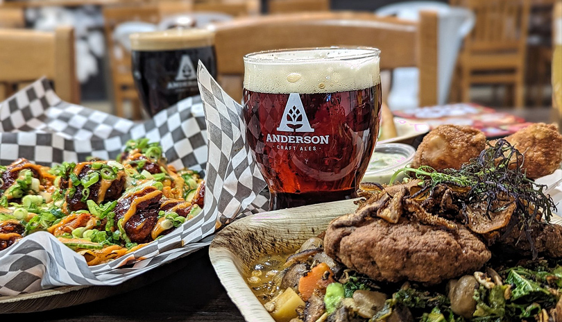 Food and beer presented on a table from Anderson Craft Ales, located in London, Ontario, Canada