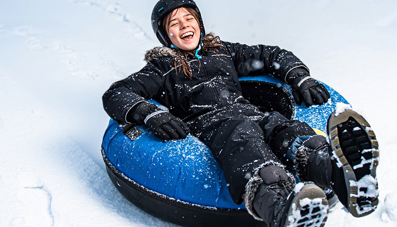 A young girl tubing at Boler Mountain in London, Ontario