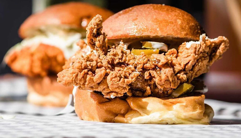 Fried Chicken sandwich sitting on a table from BTRMLK restaurant found in London, Ontario