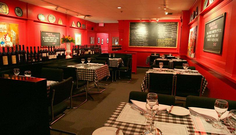 Tables and chairs set for dinner service at David's Bistro