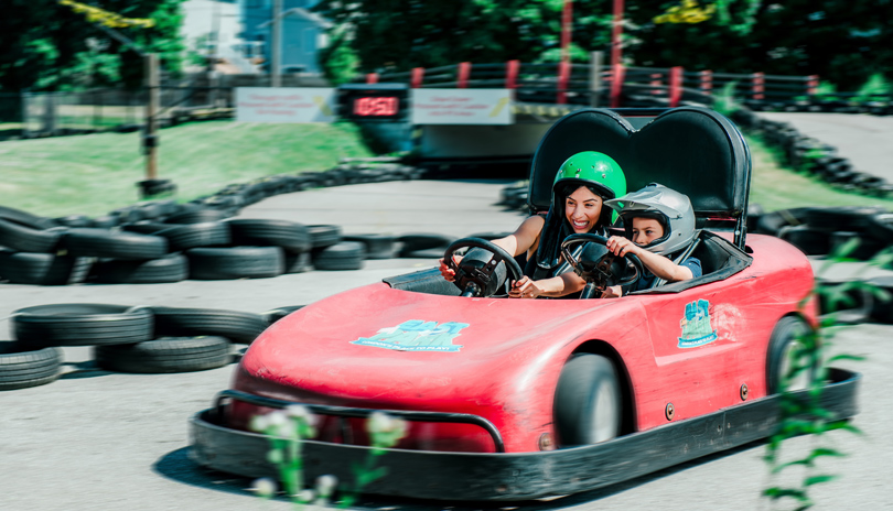 A mother and her son riding together in a Gocart at East Park in London, Ontario, Canada