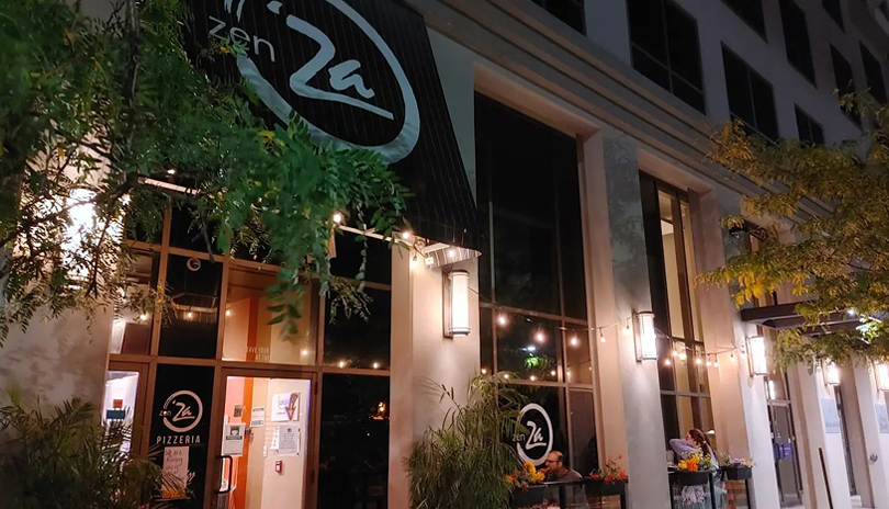 The exterior entrance and patio of Zen'za Pizzeria located in London, Ontario