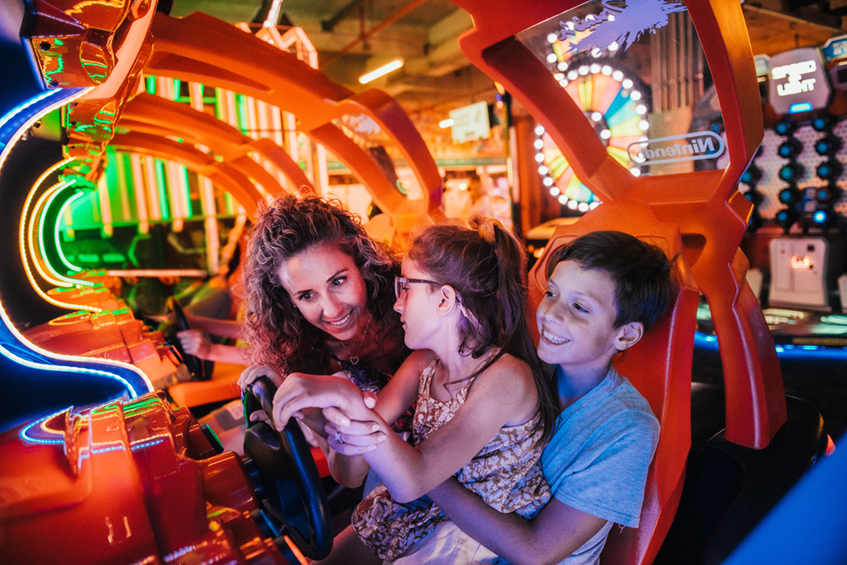 Family plays video games inside the Factory