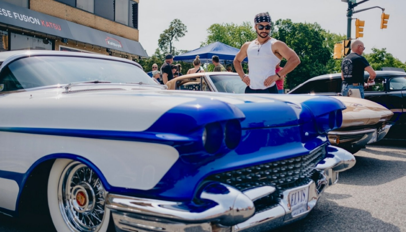 Man looks at classic car at Rides on Richmond event.