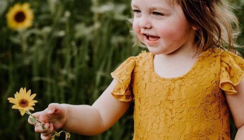 Girl with flowers at Clovermead Adventure Farm