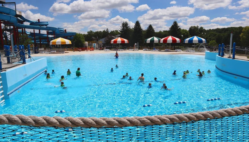 Pool at East Park filled with swimmers in the summertime