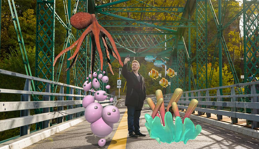 man on bridge using his phone with engage AR characters around him