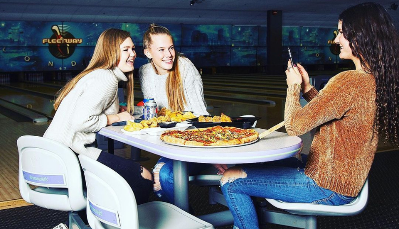 Girls eating pizza at Fleetway