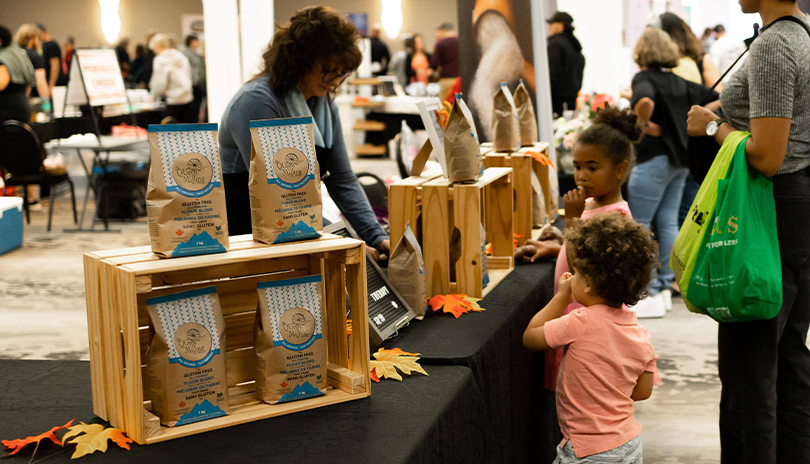 Two Children learning about gluten-free living at gluten free fest at Centennial Hall in London, Ontario