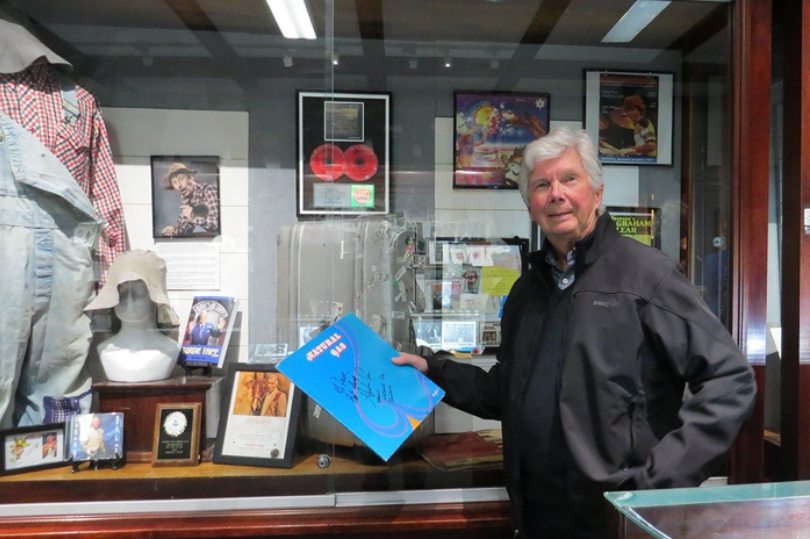 Carlos Santana drummer Graham Lear holding a record at the The London Music Hall of Fame located in London, Ontario