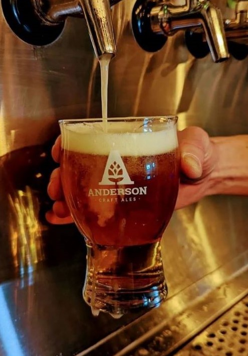 Beer being dispensed into an Anderson Craft Ale glass
