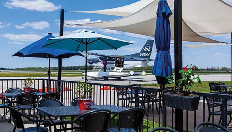 View of Katana Kafe's patio with the London International Airport strip in the background