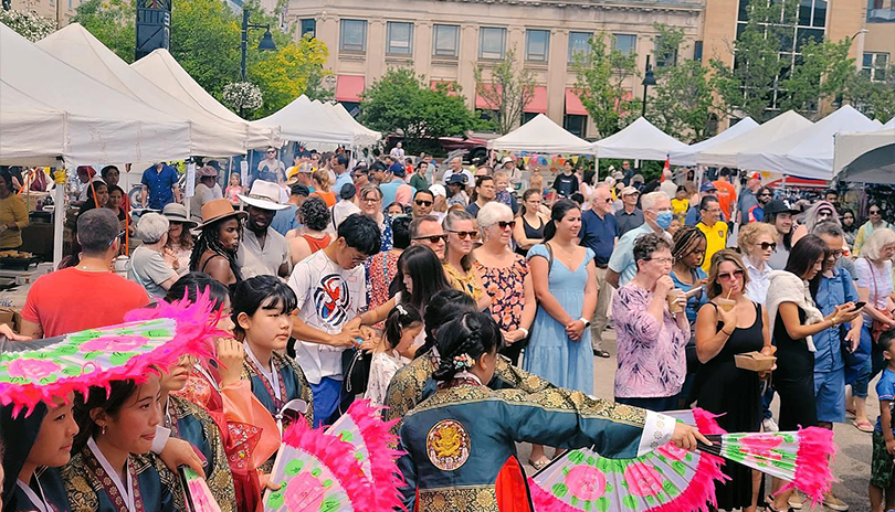 Crowd of people celebrating cultural festivities at London Multicultural Festival